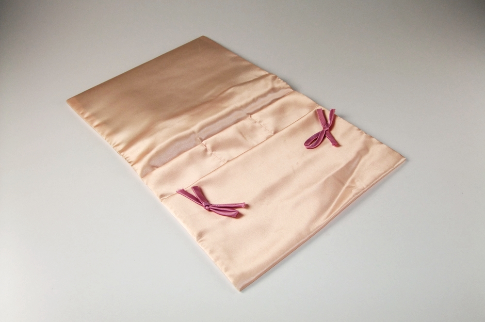 Three vintage handbags including a black purse with petit point 