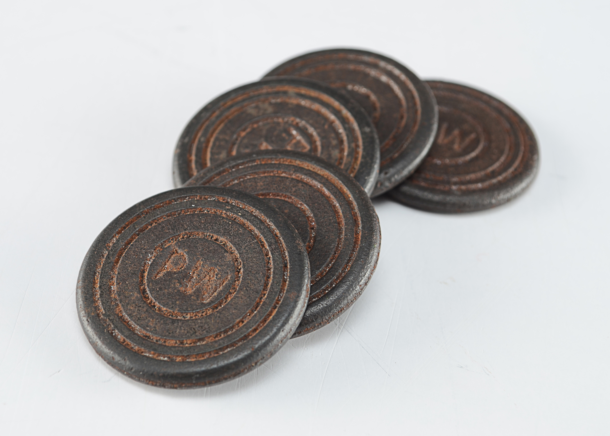 Five Small Round Cast Iron Markers