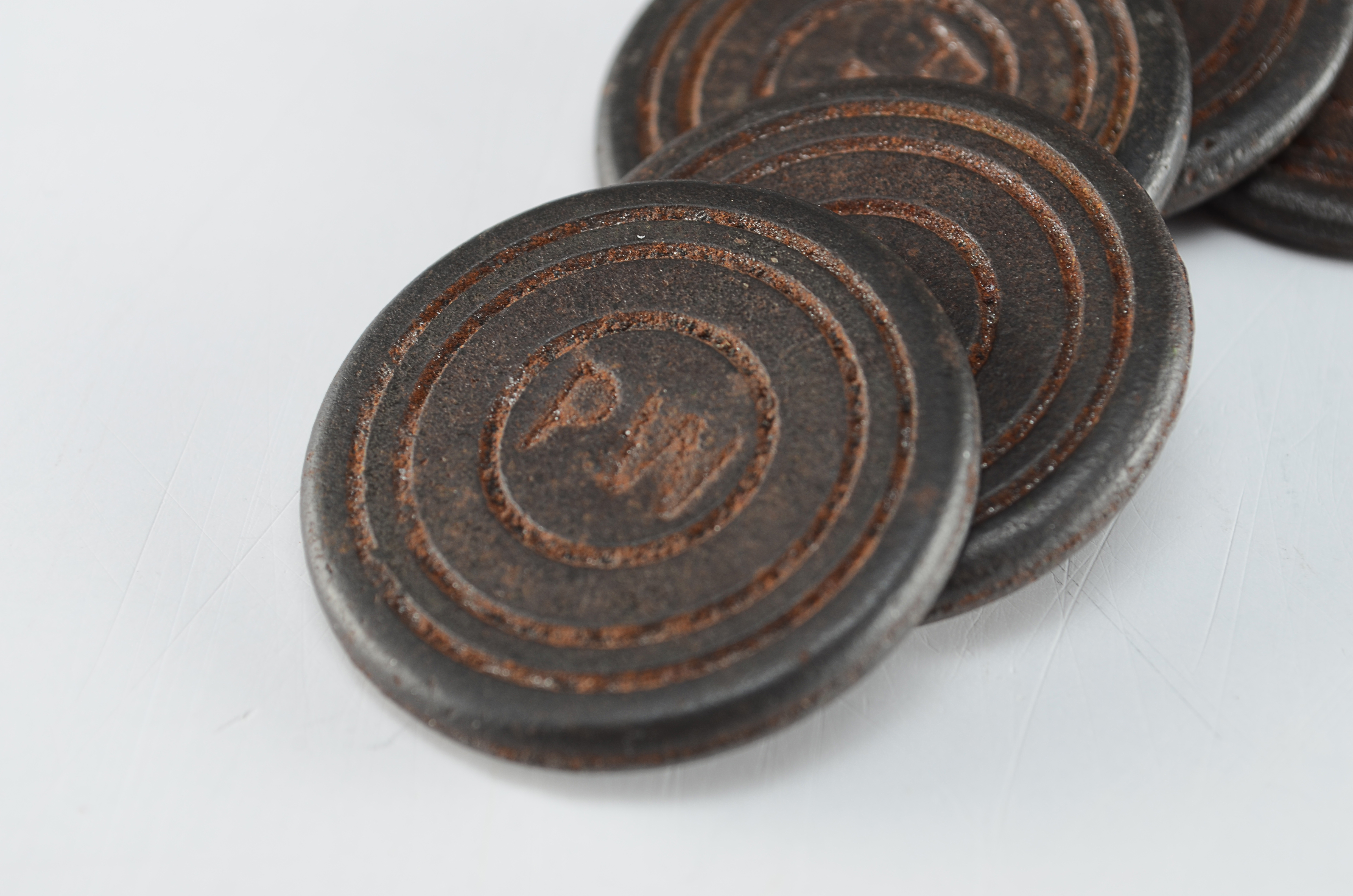 Five Small Round Cast Iron Markers