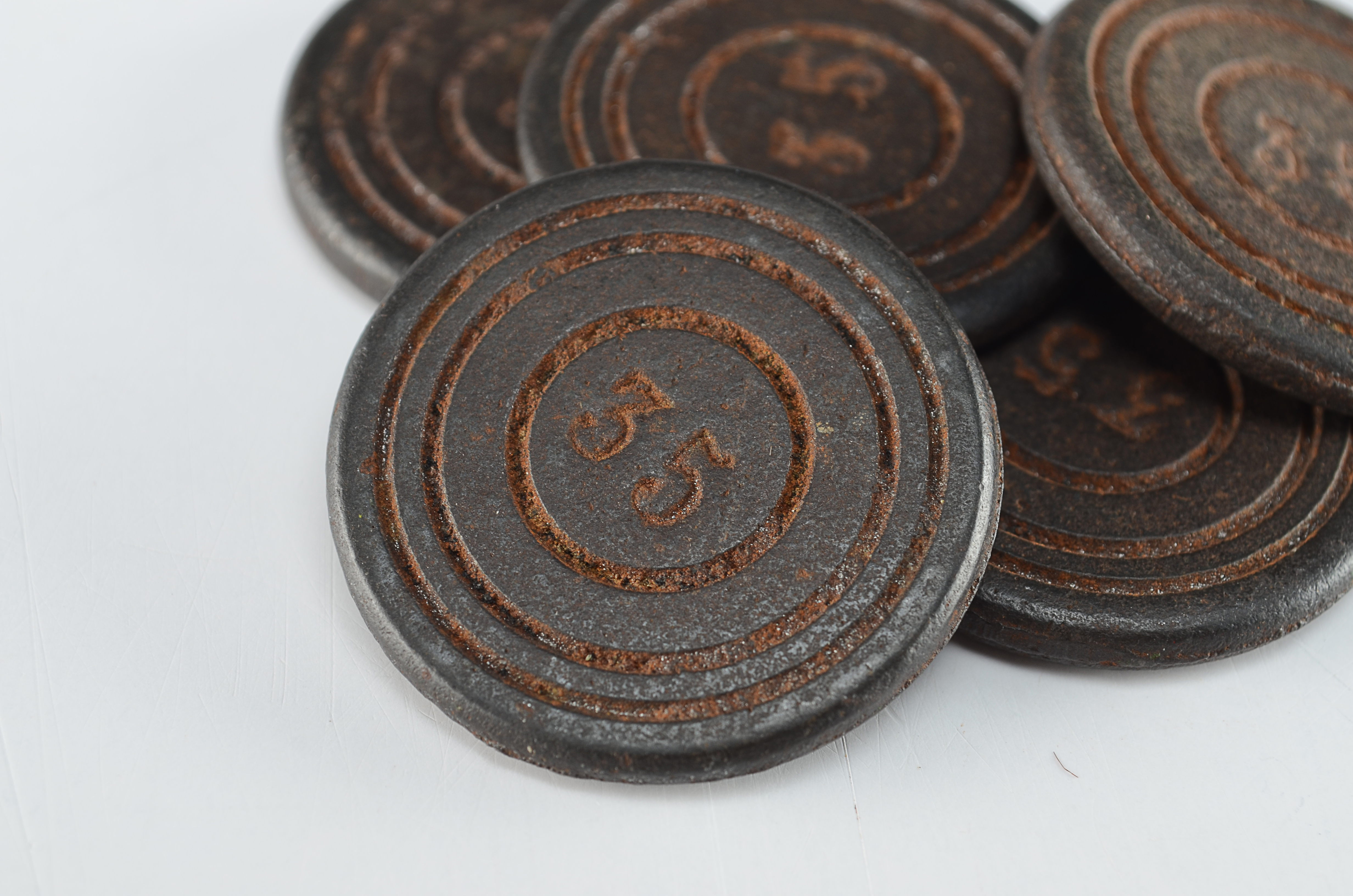 Five Small Round Cast Iron Markers