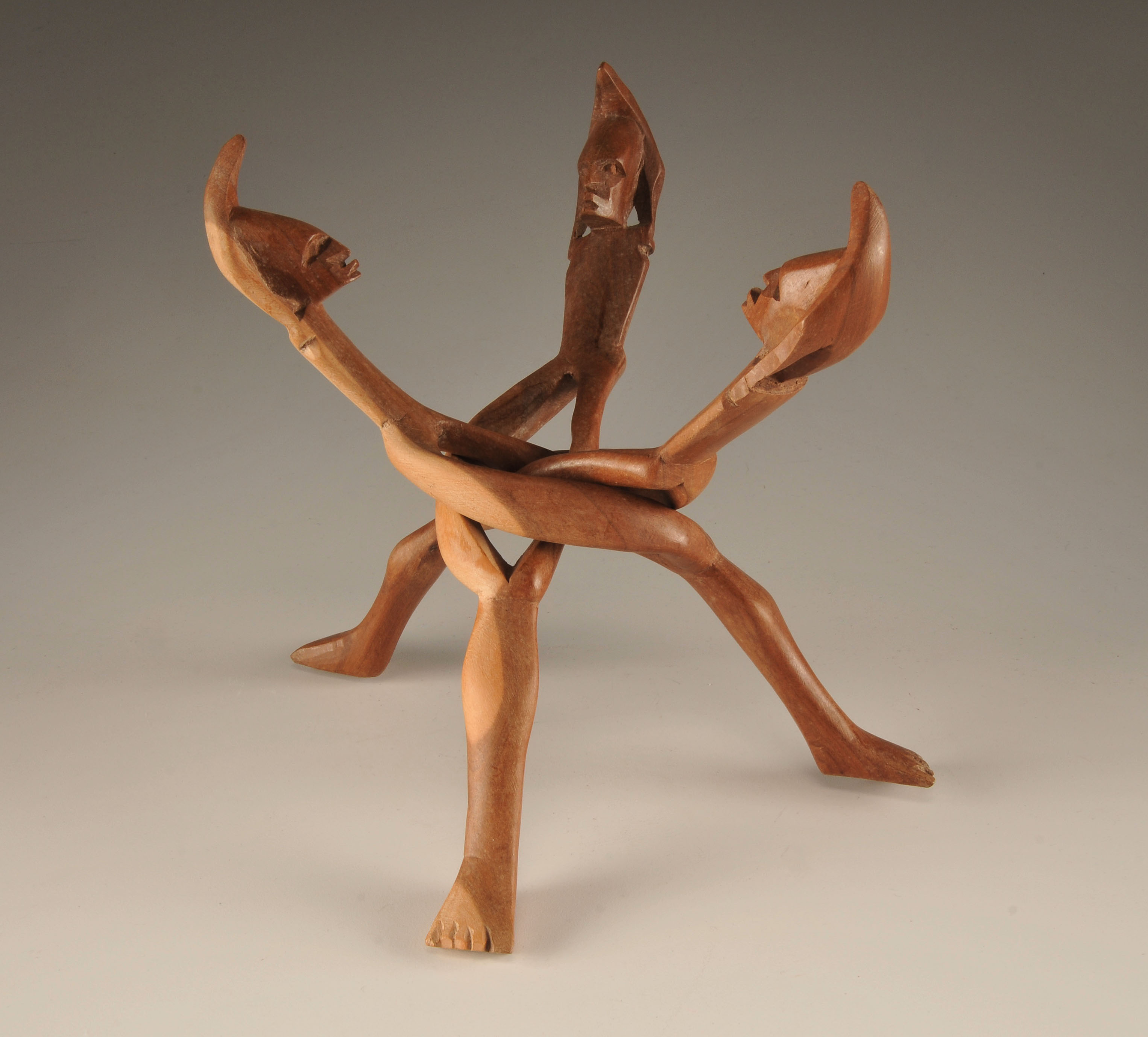  Vintage hand carved African "friends" sculpture of three intertwining figures with head dresses