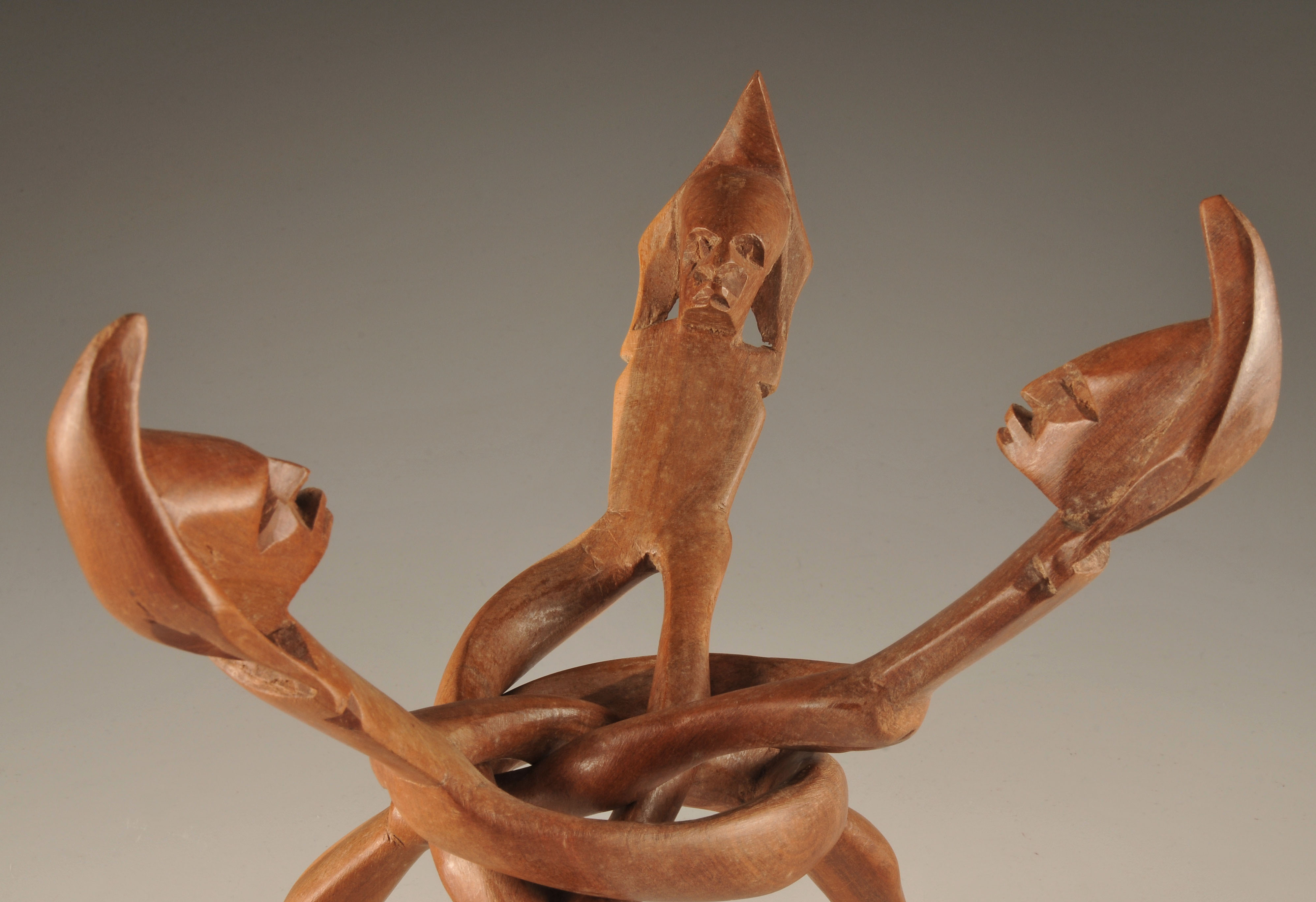  Vintage hand carved African "friends" sculpture of three intertwining figures with head dresses