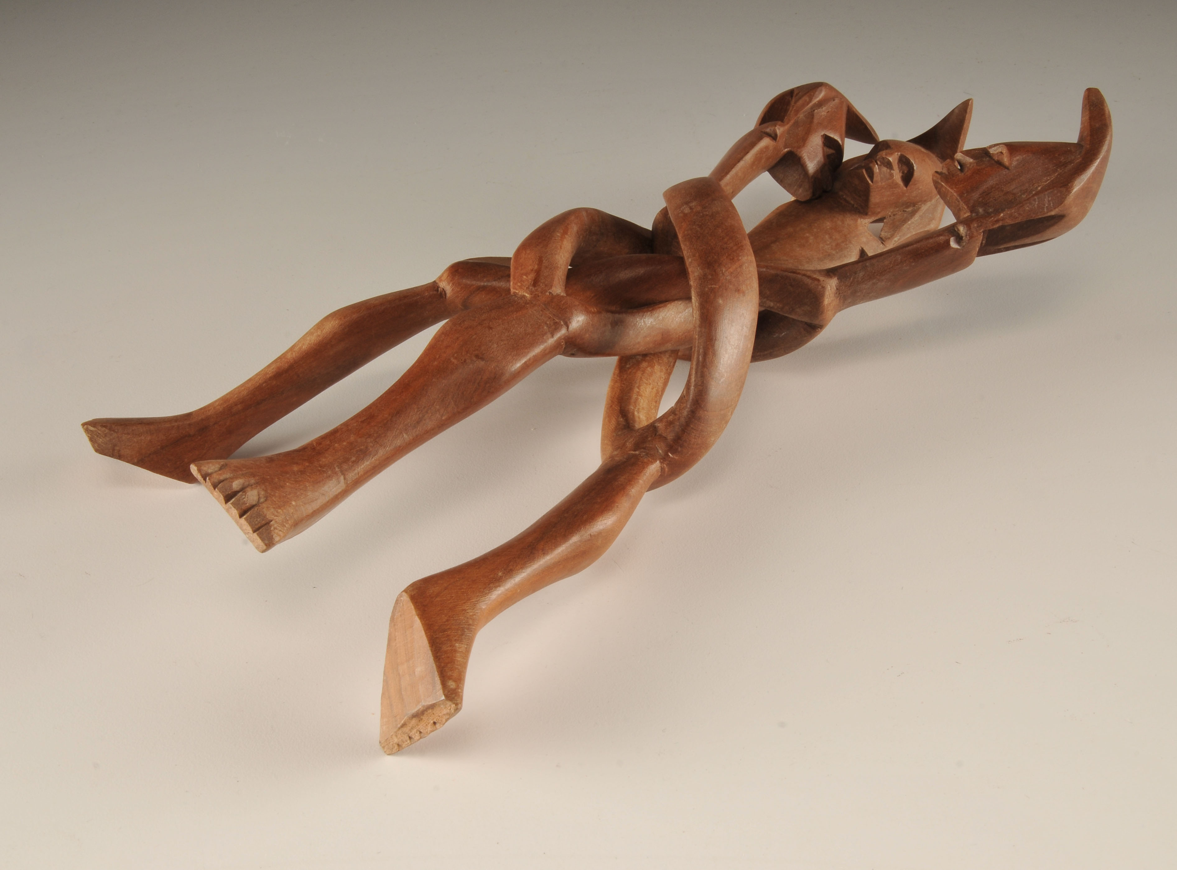  Vintage hand carved African "friends" sculpture of three intertwining figures with head dresses