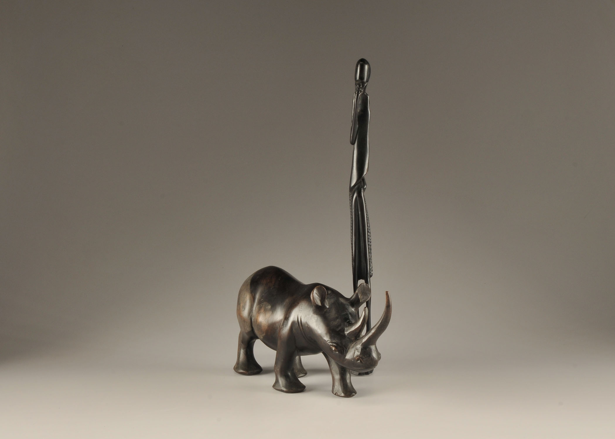 Vintage African hand carved Rhinoceros and Tribesman sculpture 