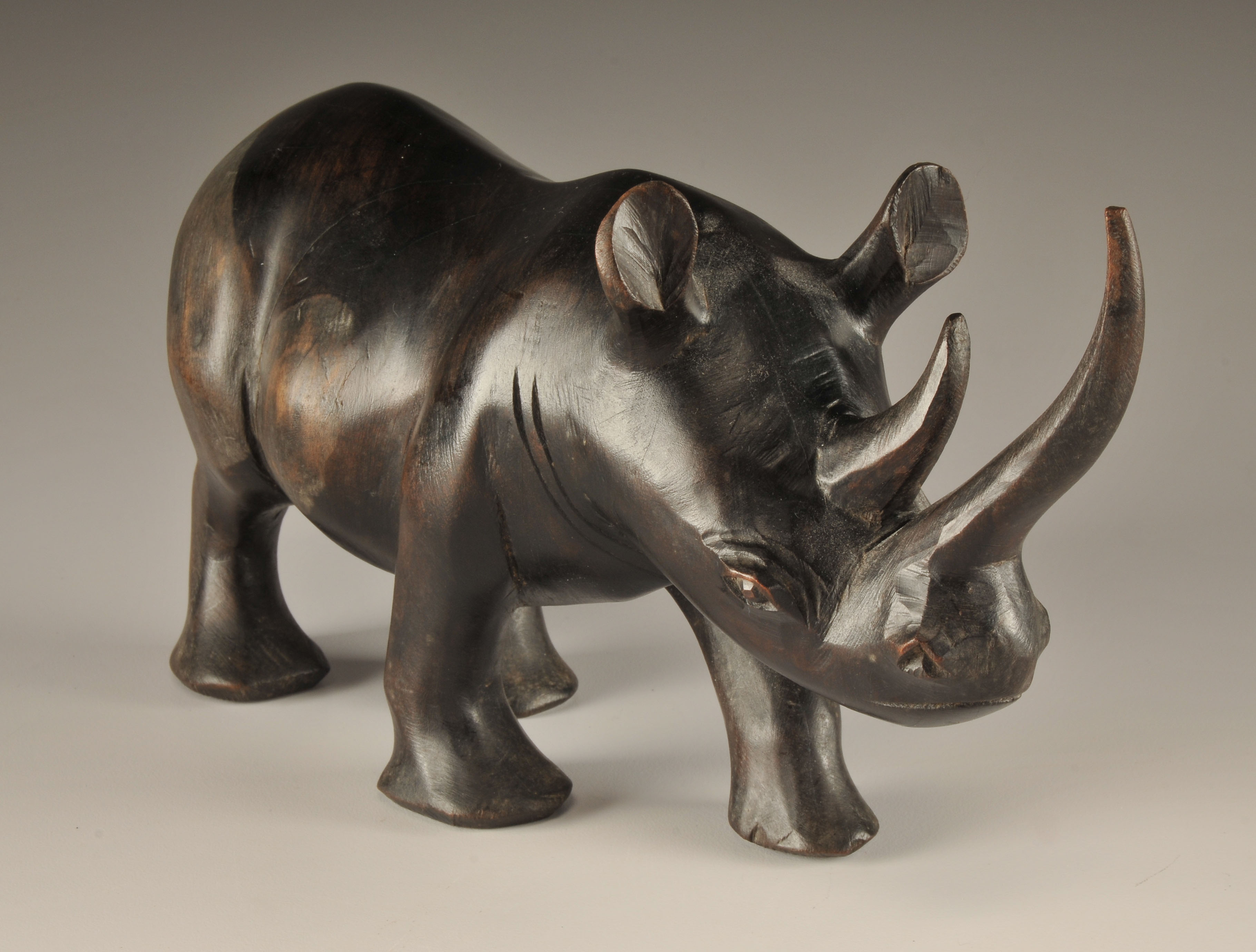 Vintage African hand carved Rhinoceros and Tribesman sculpture 