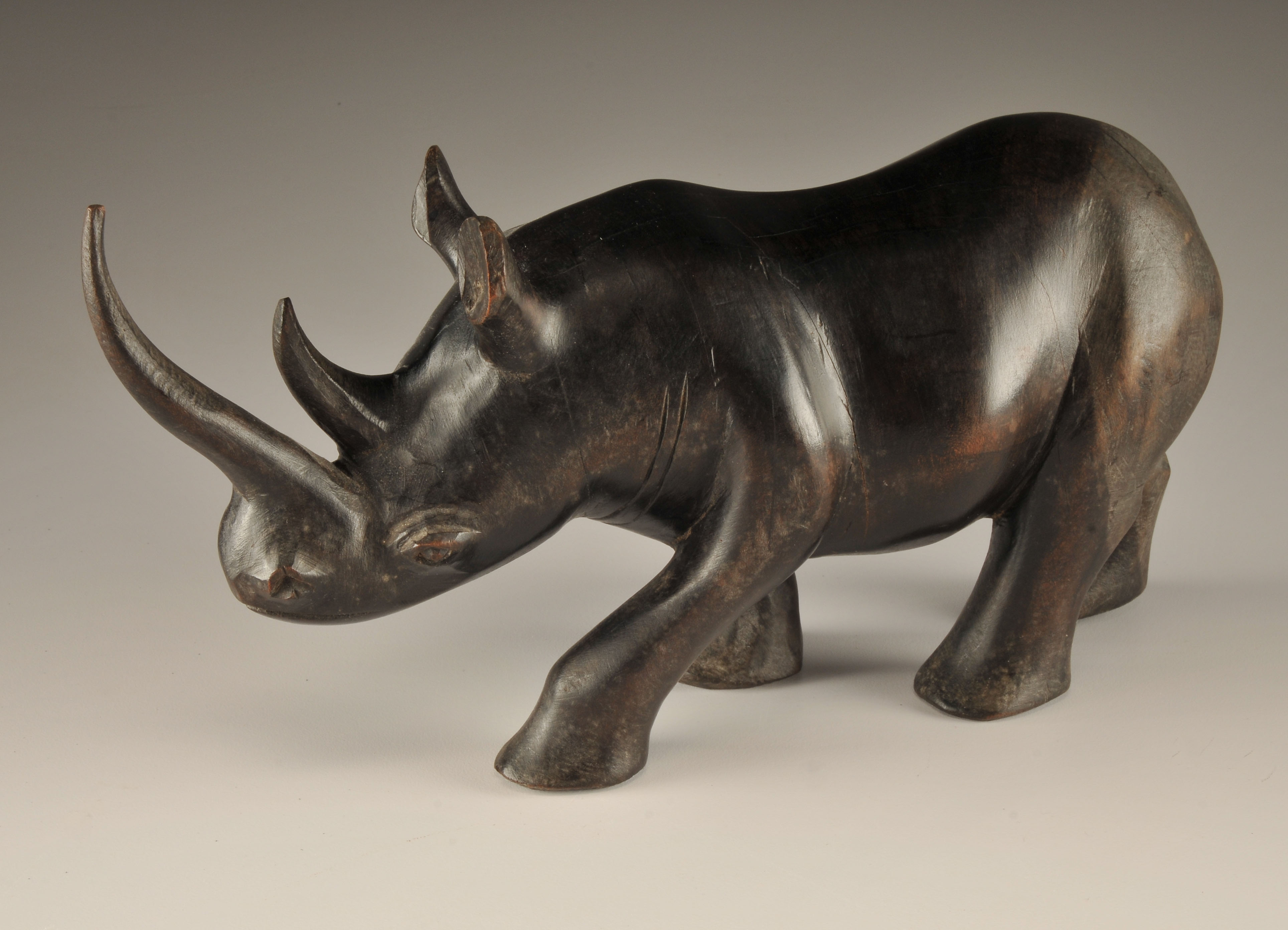 Vintage African hand carved Rhinoceros and Tribesman sculpture 