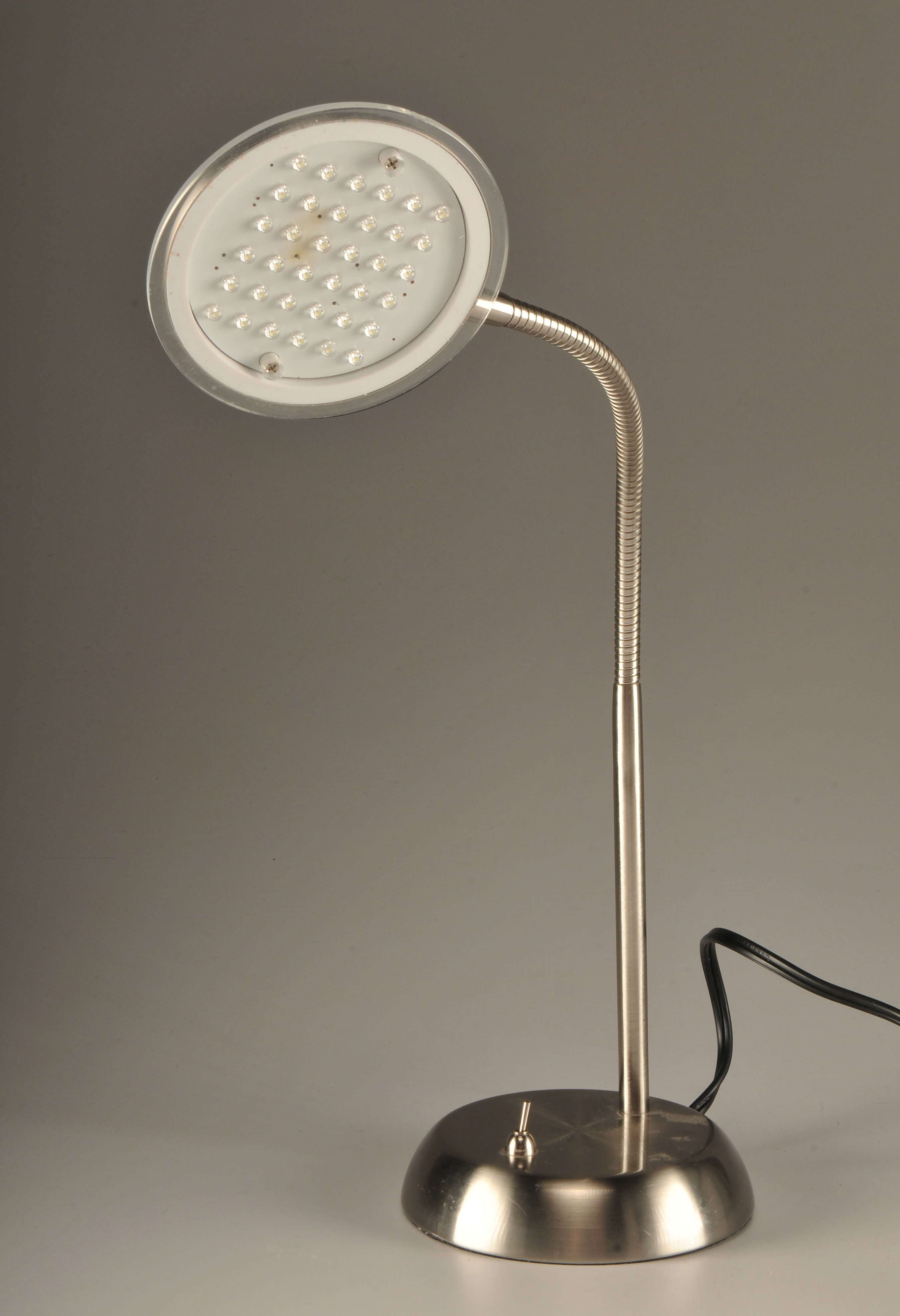  Modern portable lamp in stainless steel with bendable coiled stem 