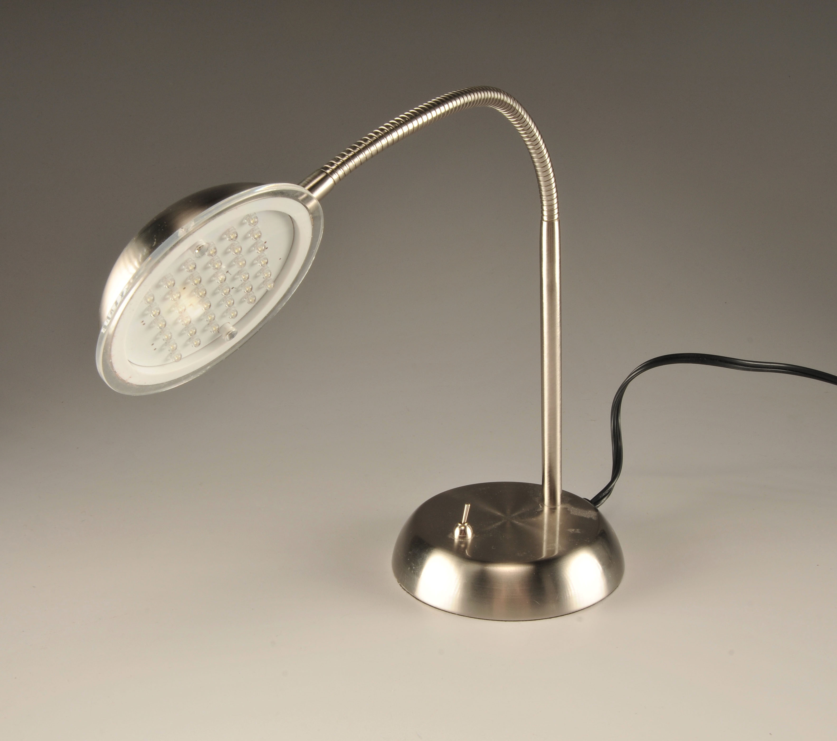  Modern portable lamp in stainless steel with bendable coiled stem 