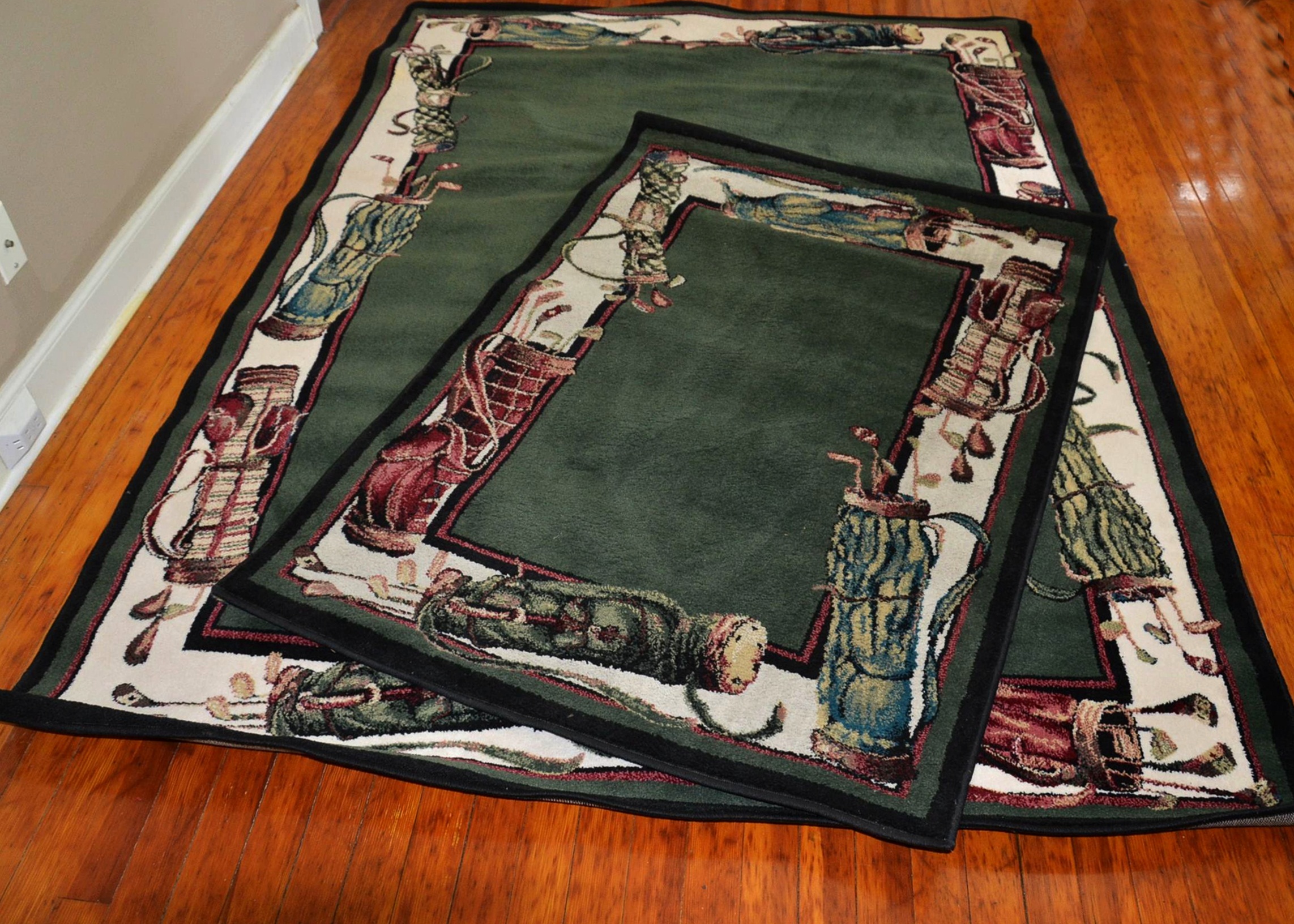 Pair of Shaw Industries golf themed rugs.