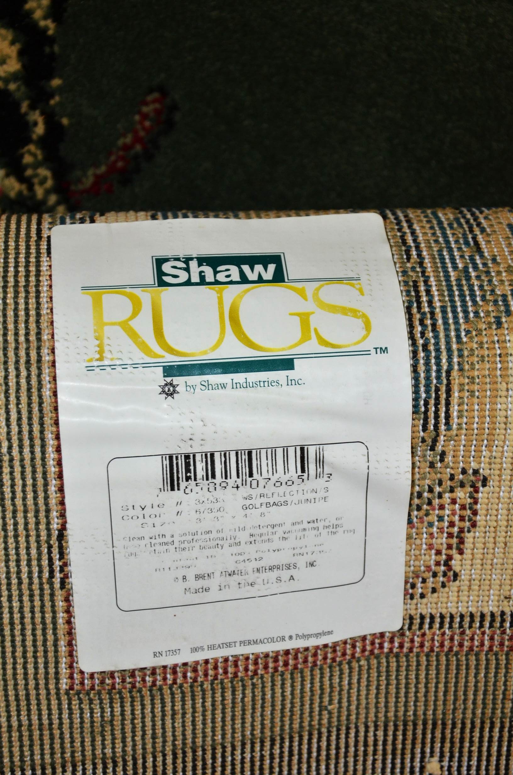 Pair of Shaw Industries golf themed rugs.