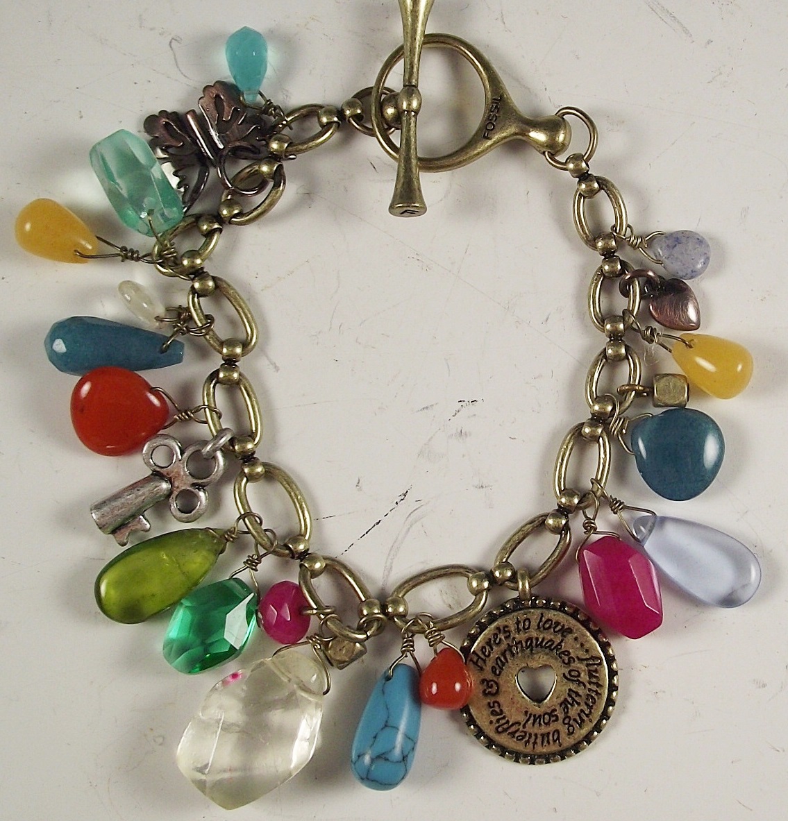 Fossil bracelet and Coach engagement book.