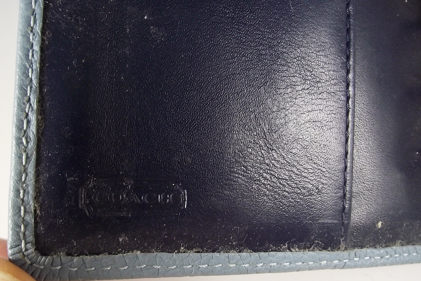 Fossil bracelet and Coach engagement book.