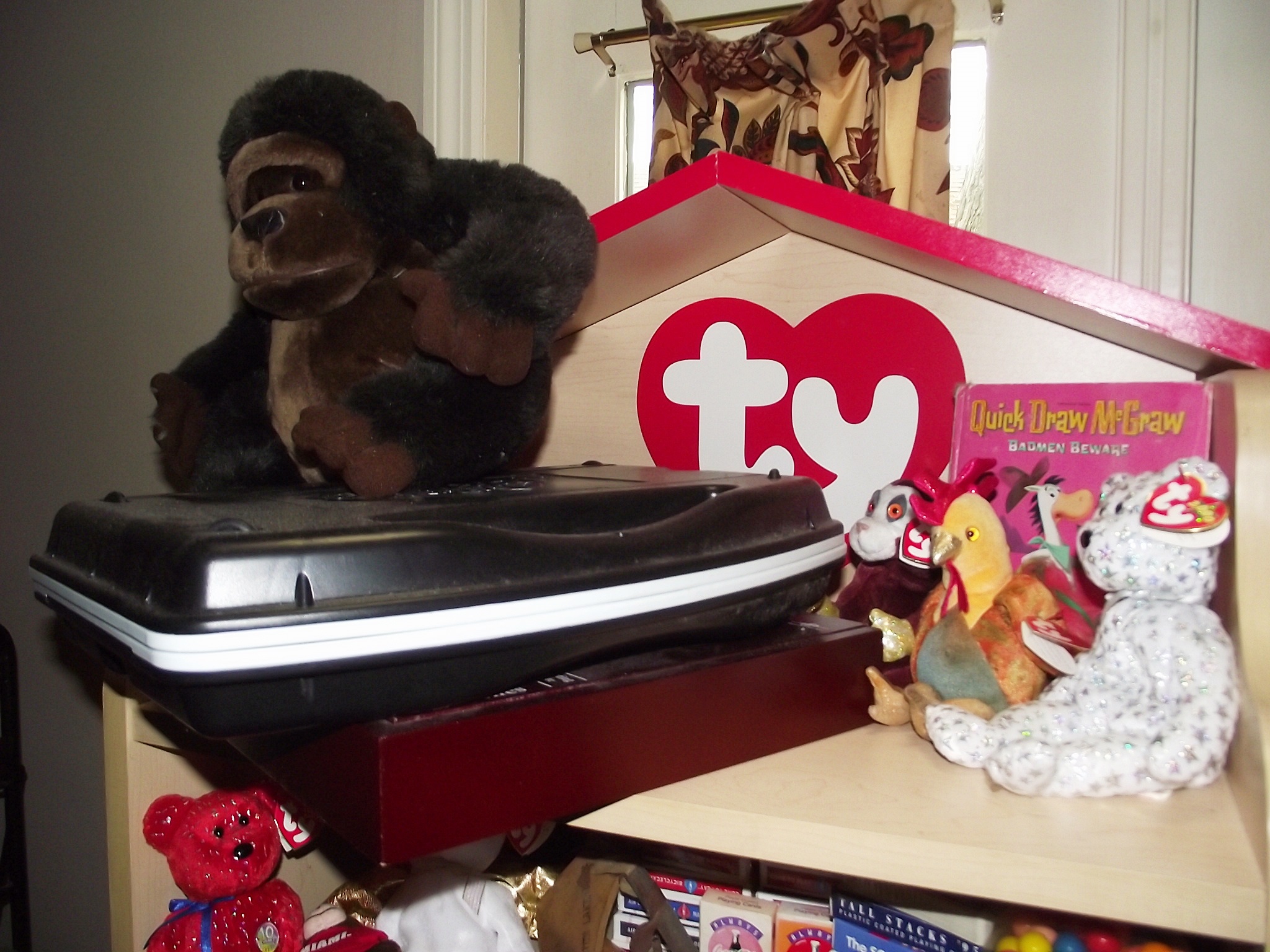 Group of toys and TY shelving unit.