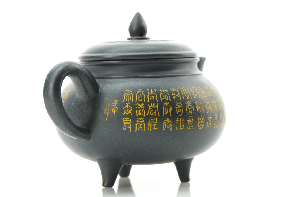 Modern Chinese Yixing earthenware teapot and a reproduction Chinese terra cotta "Standing Soldier" sculpture 