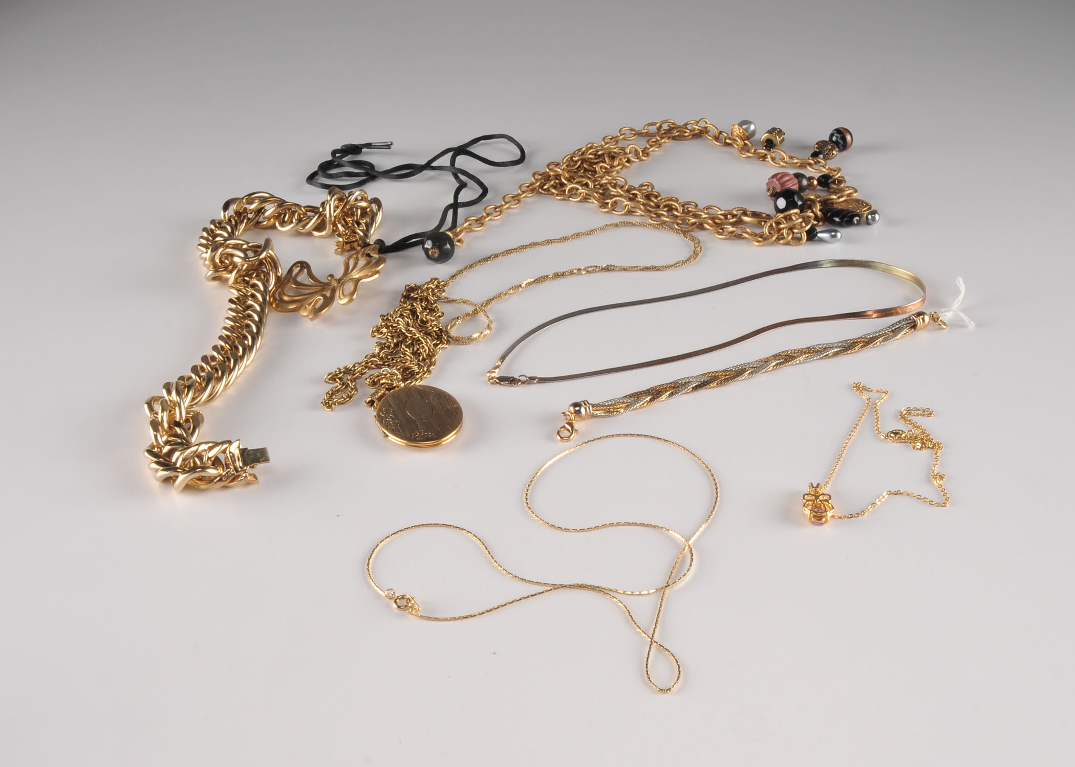 Assorted Gold Tone Costume Necklaces.