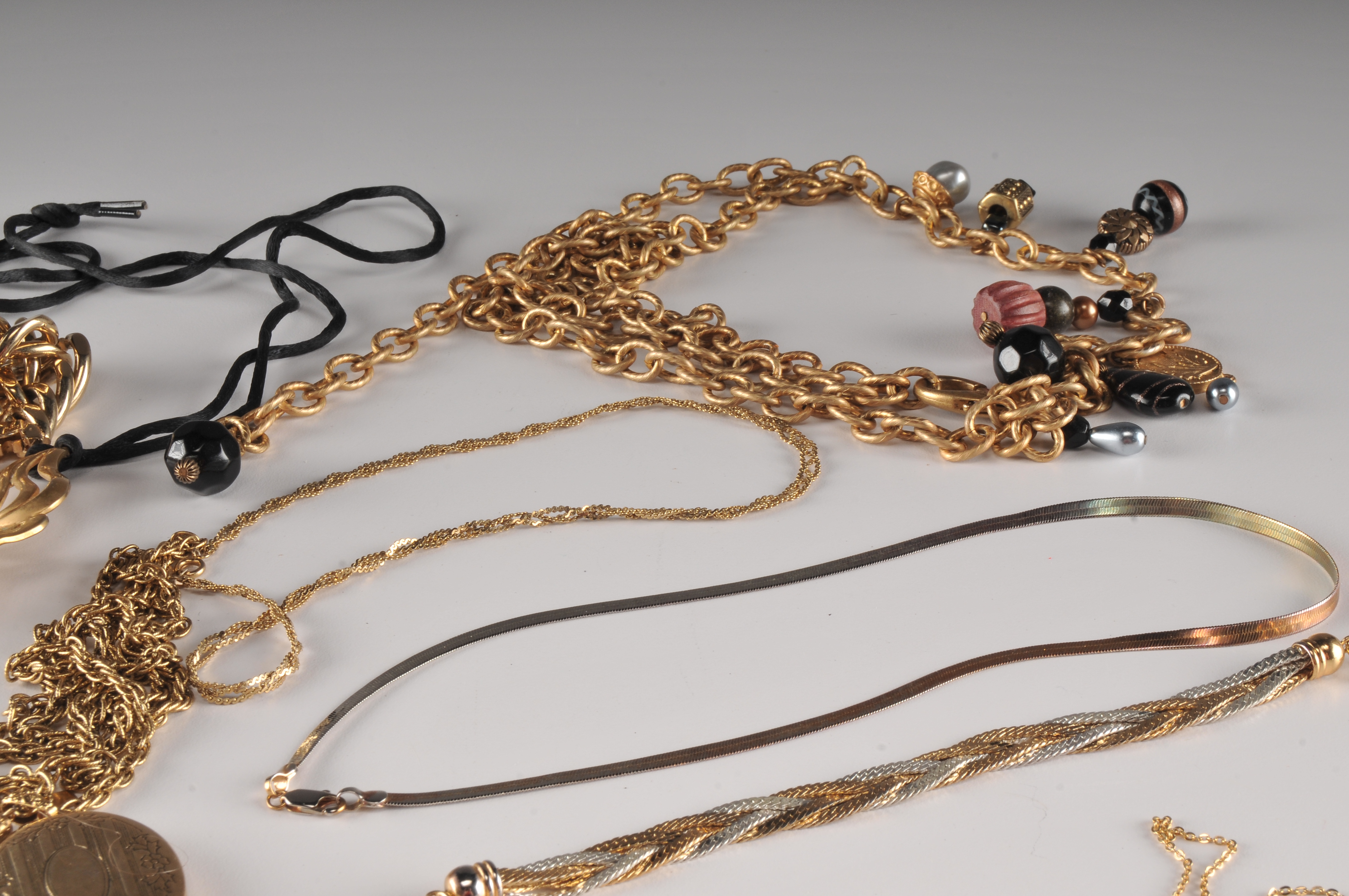 Assorted Gold Tone Costume Necklaces.