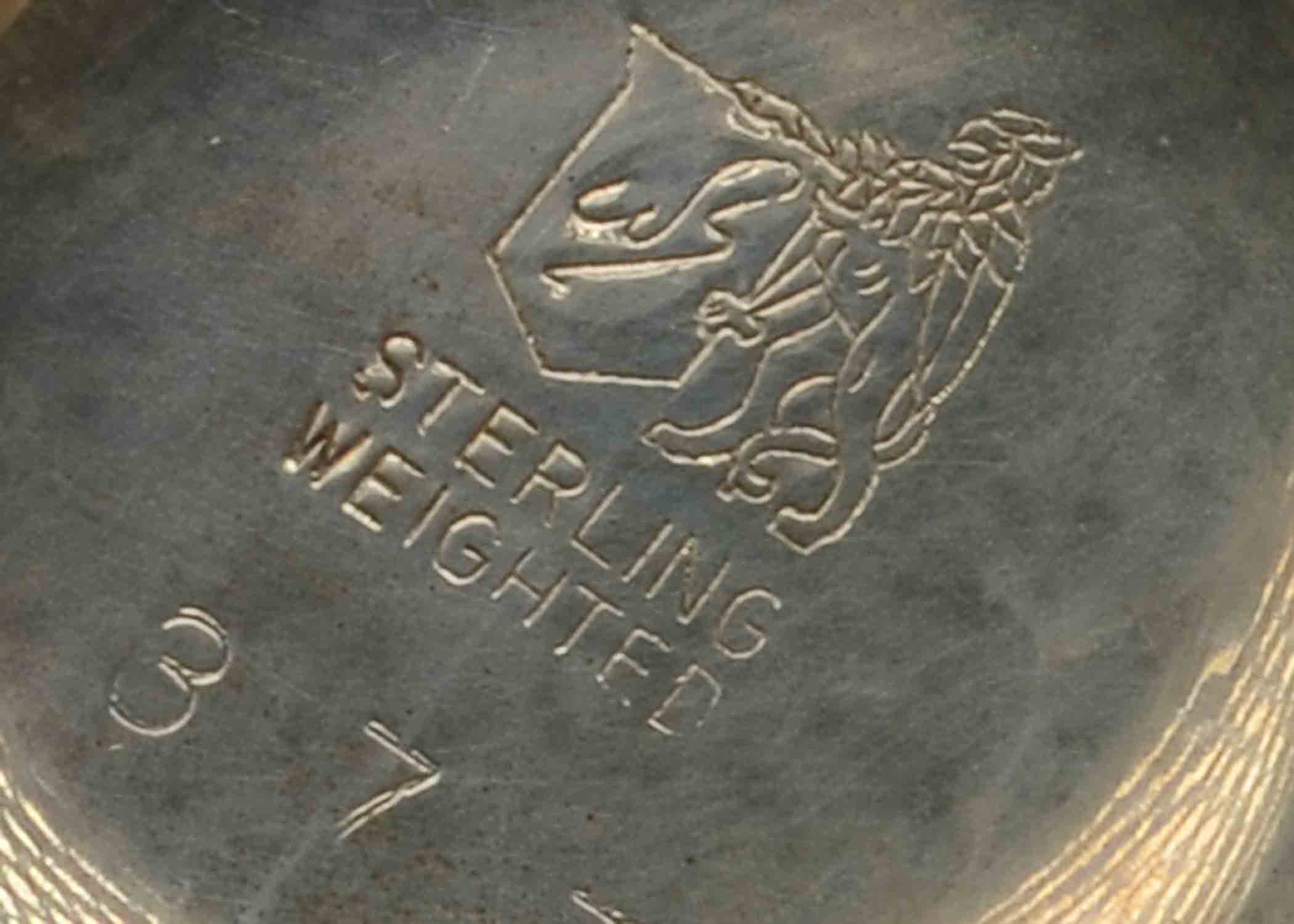 Two Weighted Silver Candelabras