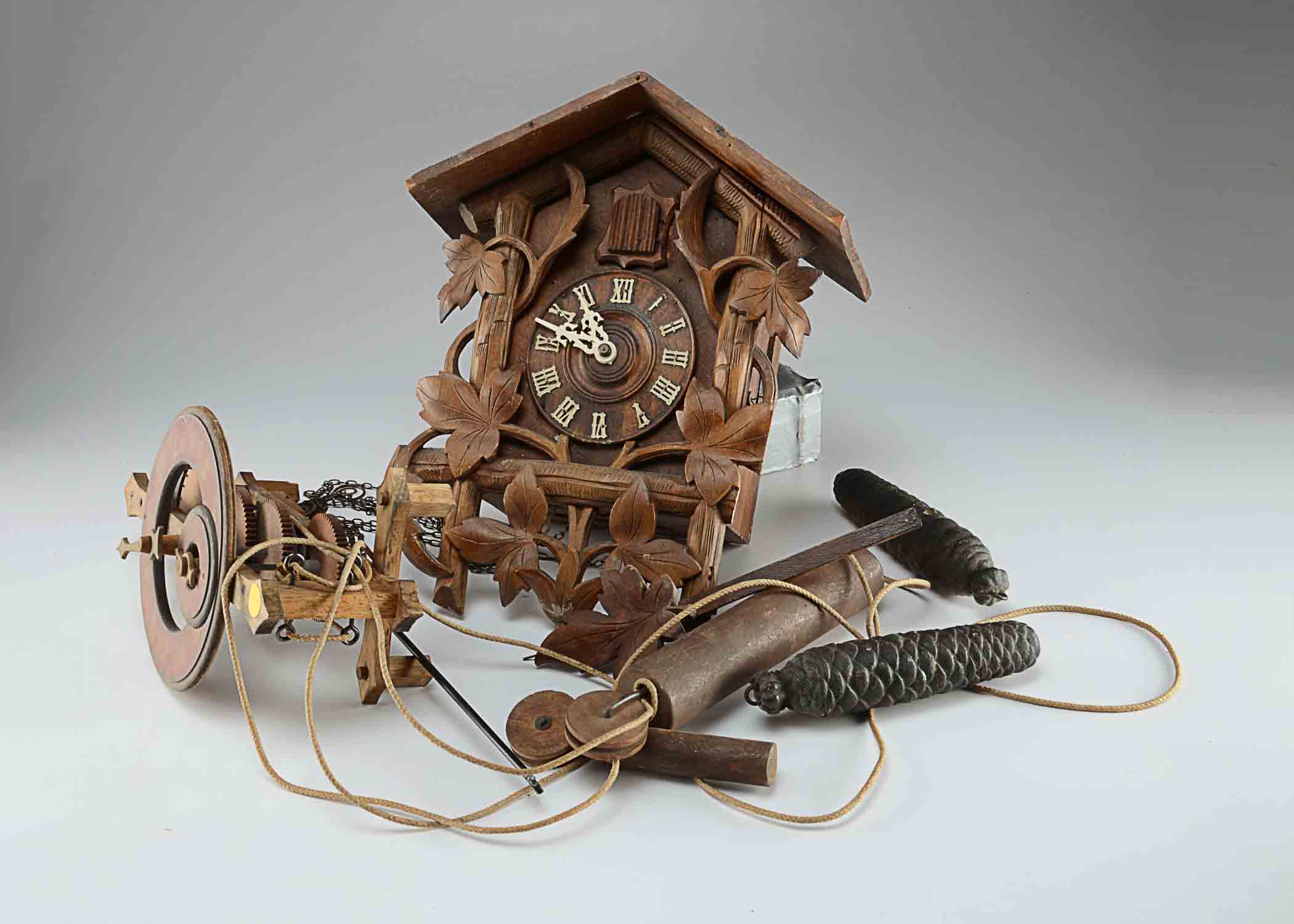 A Swiss Buco 1670 Wall Clock and A Wood Cuckoo Clock.