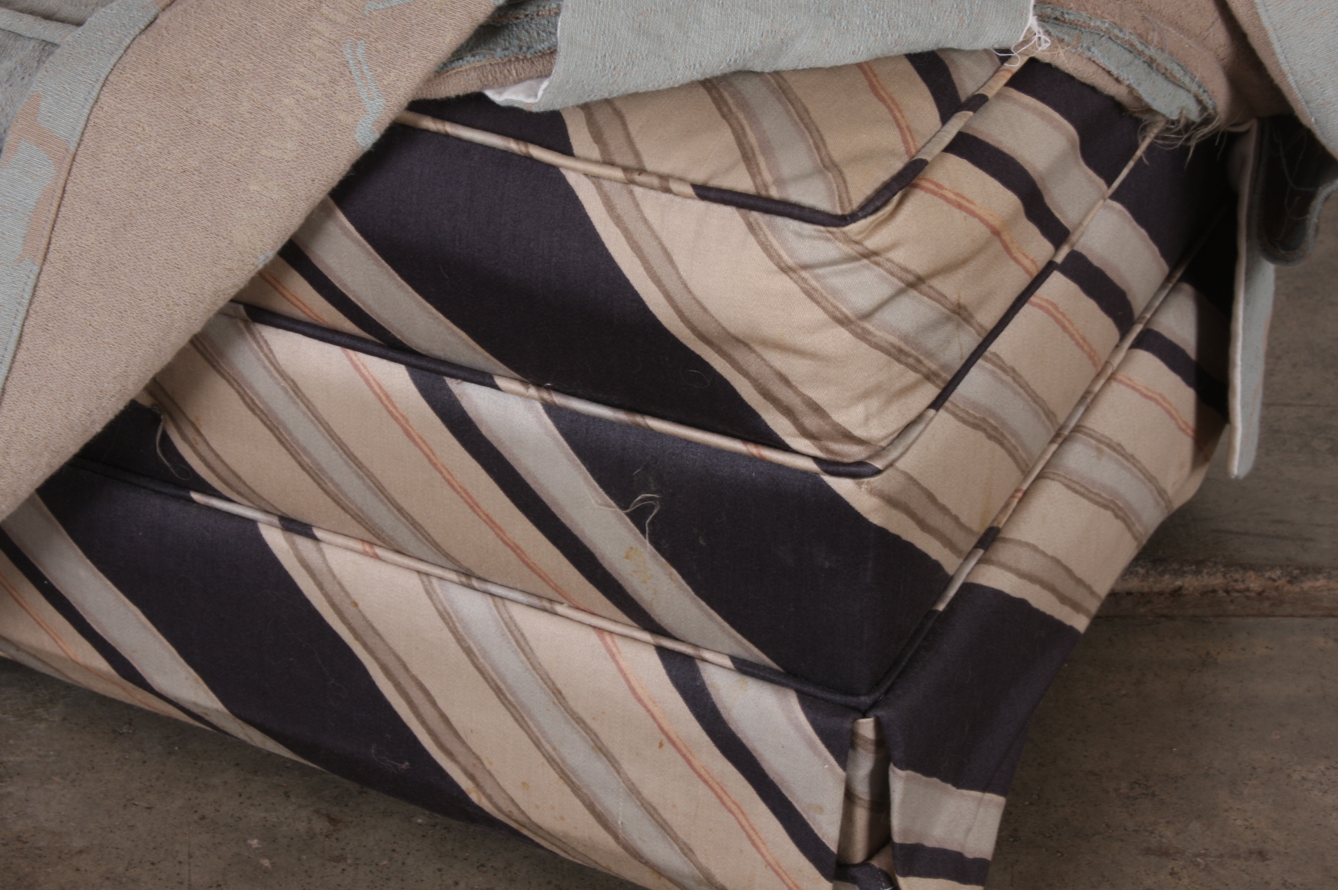 Upholstered Small Ottoman on Caster Wheels