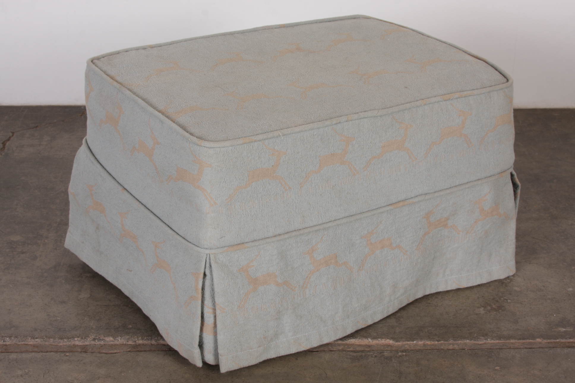 Upholstered Small Ottoman on Caster Wheels