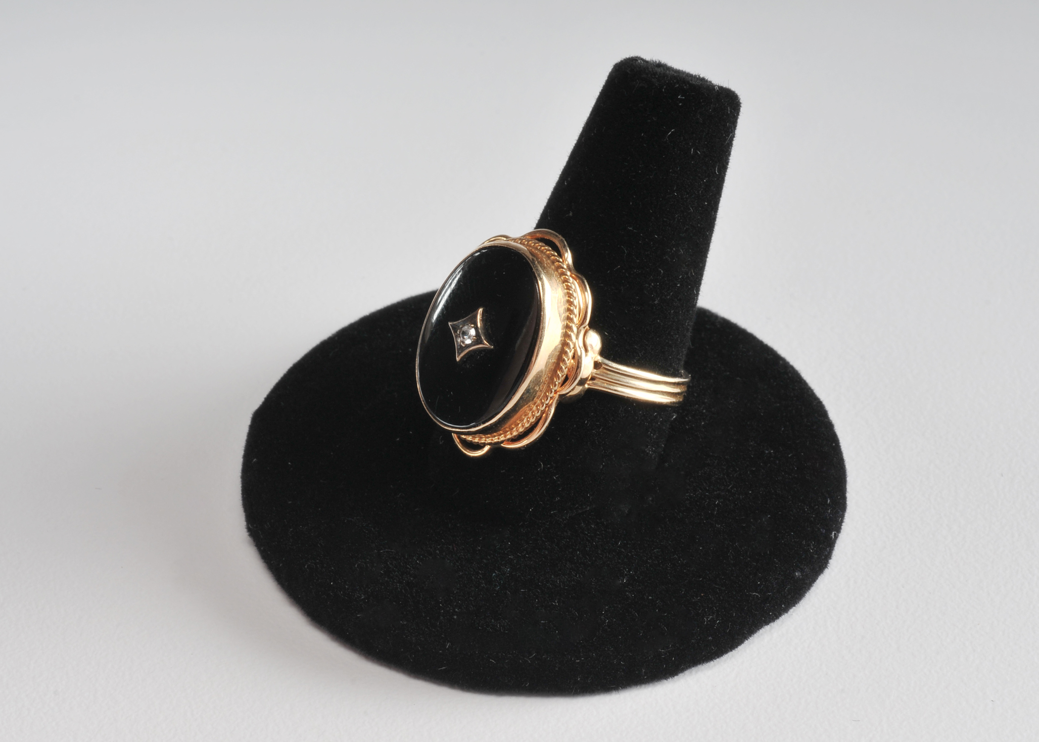 Ladies 14 K yellow gold black onyx and diamond ring