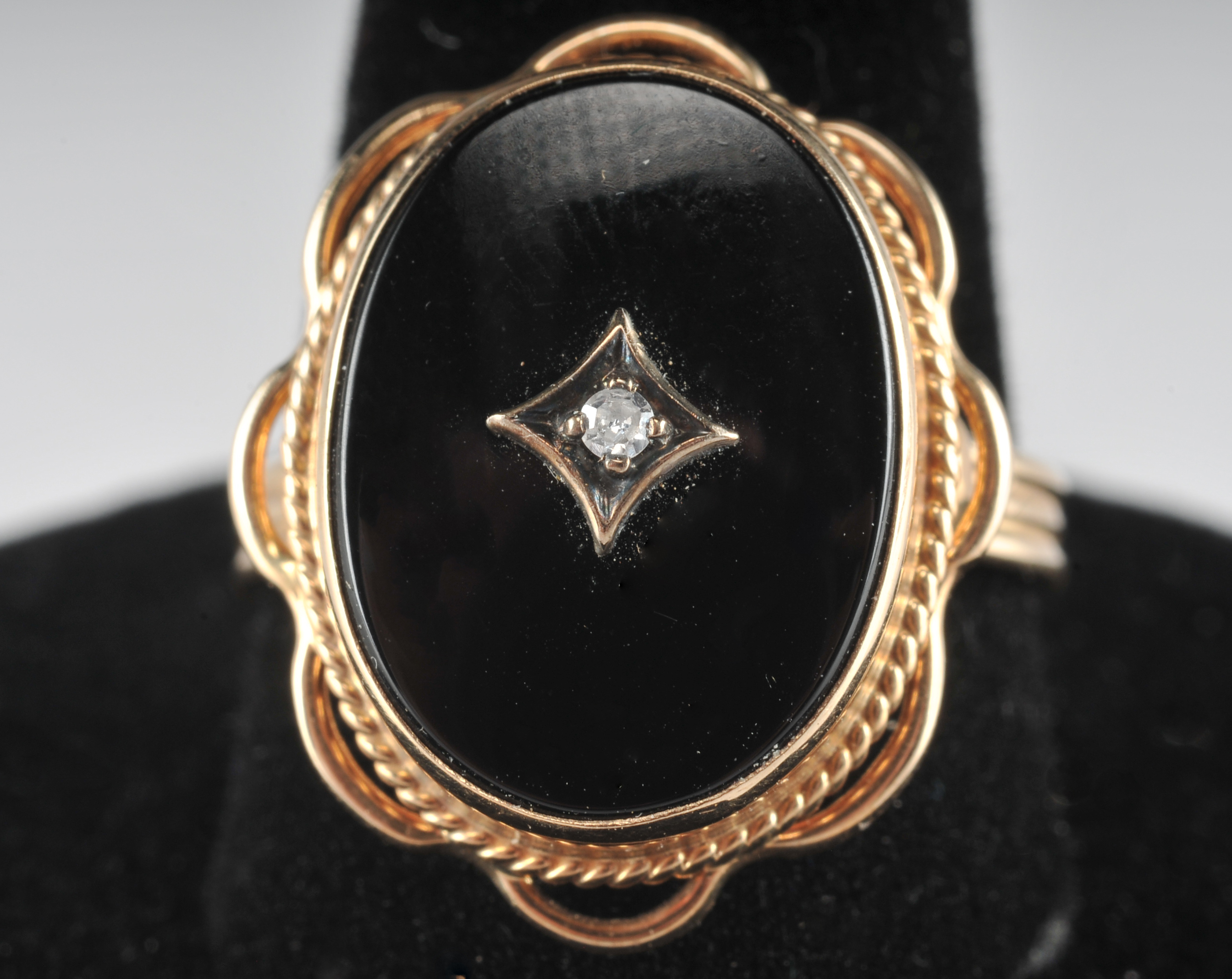 Ladies 14 K yellow gold black onyx and diamond ring