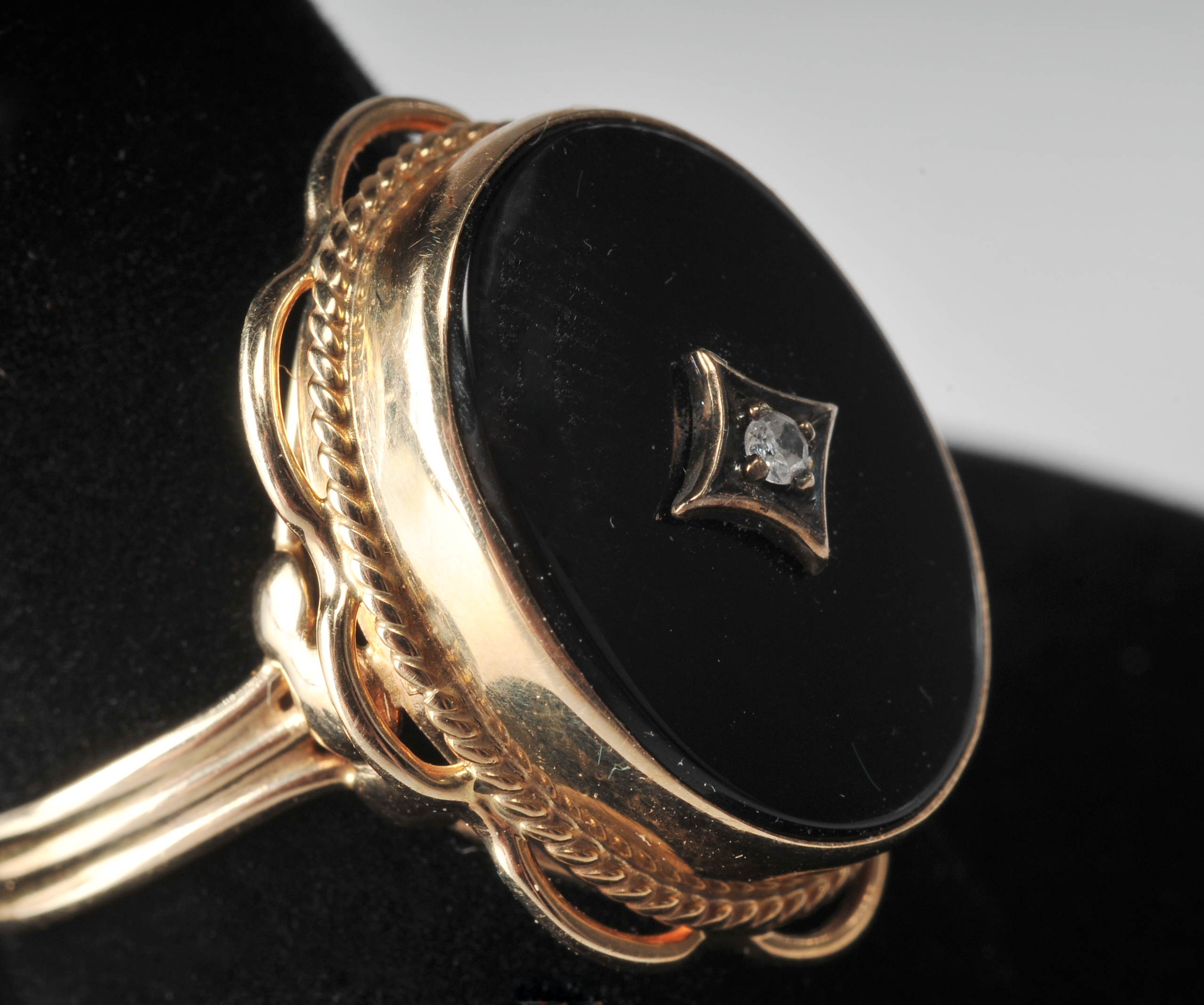 Ladies 14 K yellow gold black onyx and diamond ring