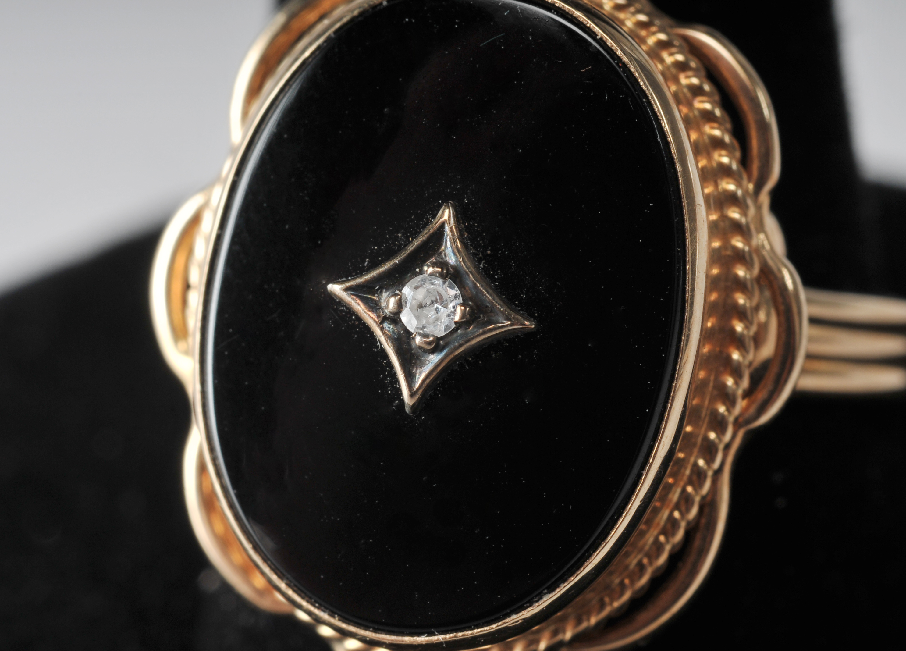 Ladies 14 K yellow gold black onyx and diamond ring
