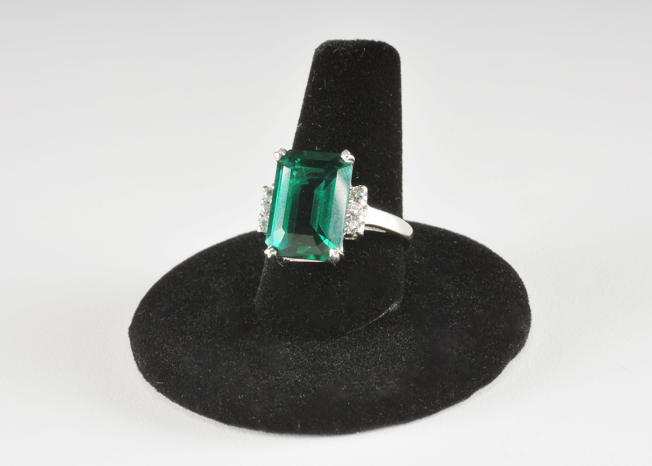 14 K white gold ladies ring with synthetic emerald and cubic zirconia stones