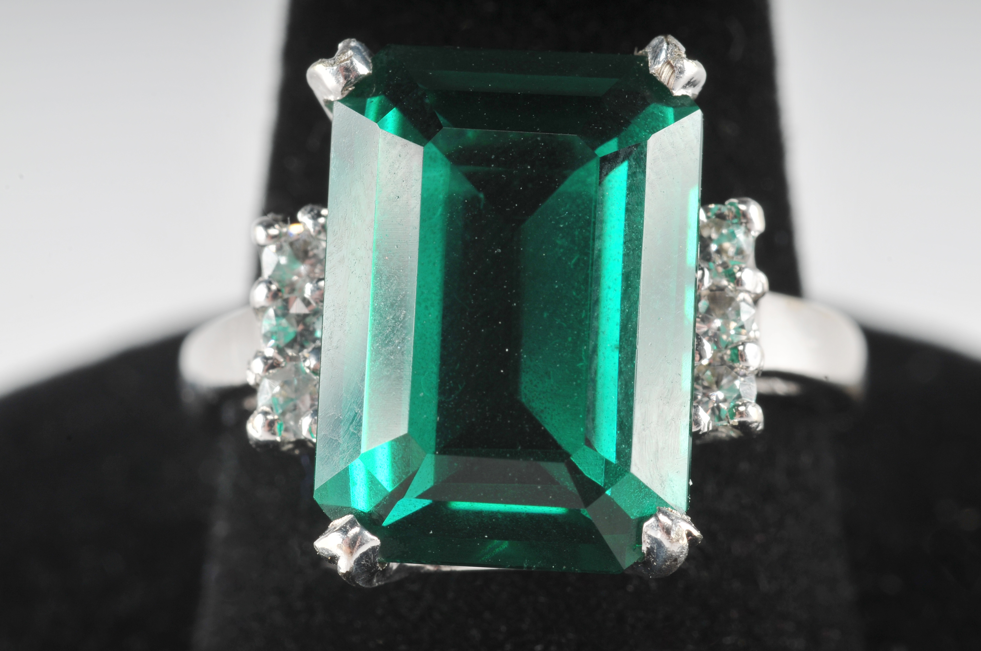 14 K white gold ladies ring with synthetic emerald and cubic zirconia stones