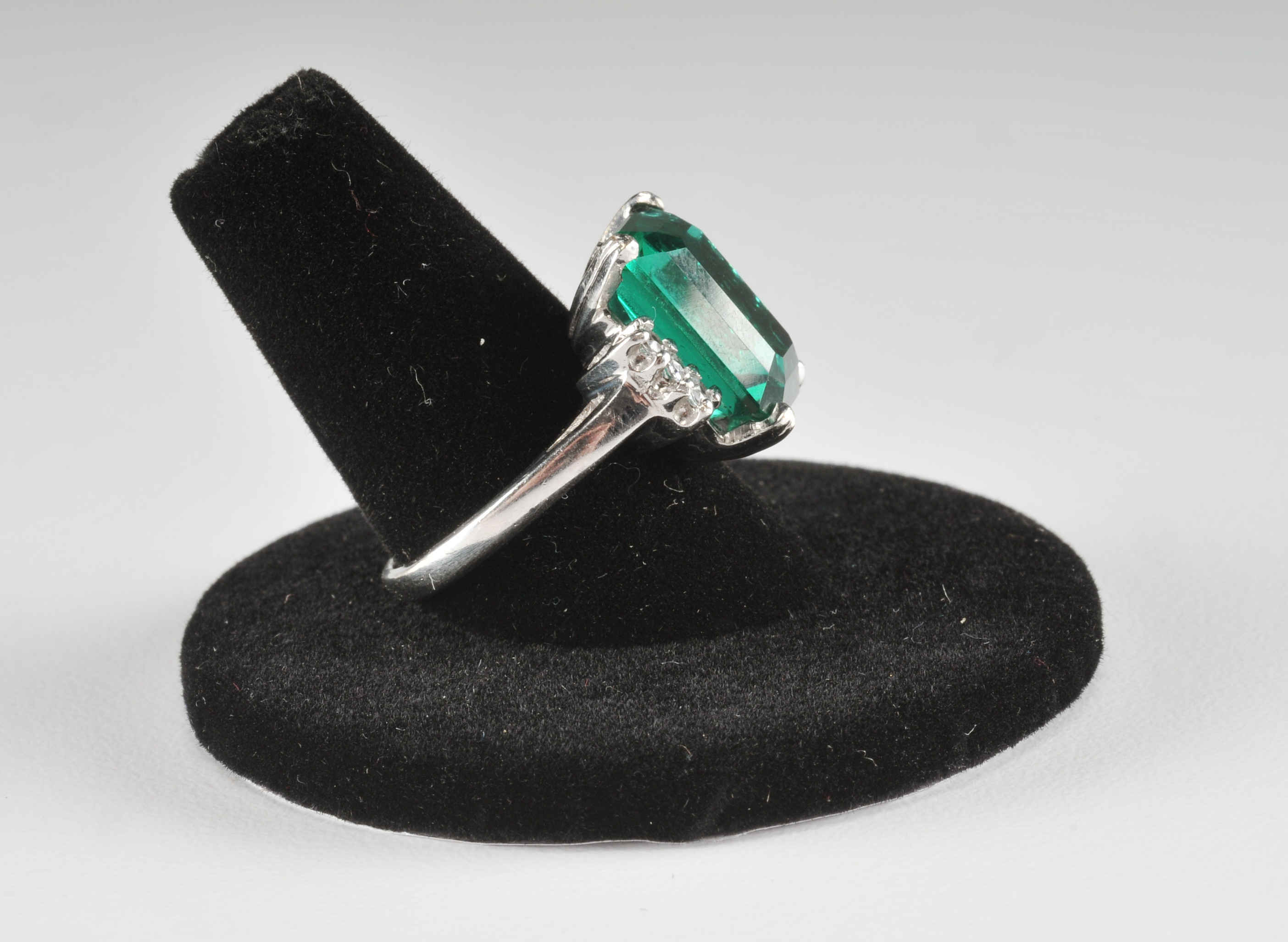 14 K white gold ladies ring with synthetic emerald and cubic zirconia stones
