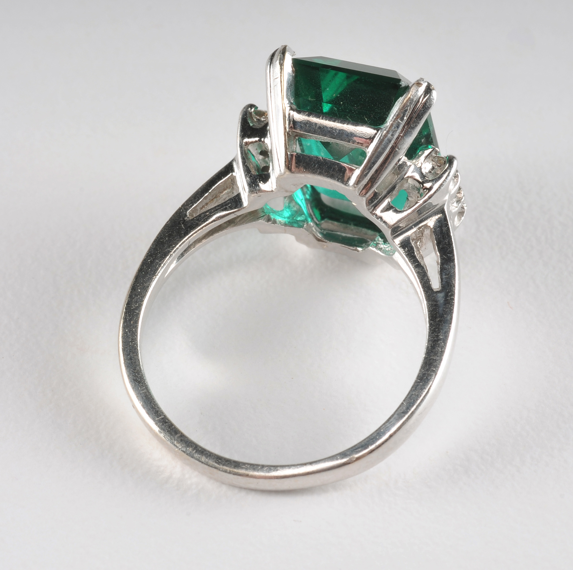 14 K white gold ladies ring with synthetic emerald and cubic zirconia stones