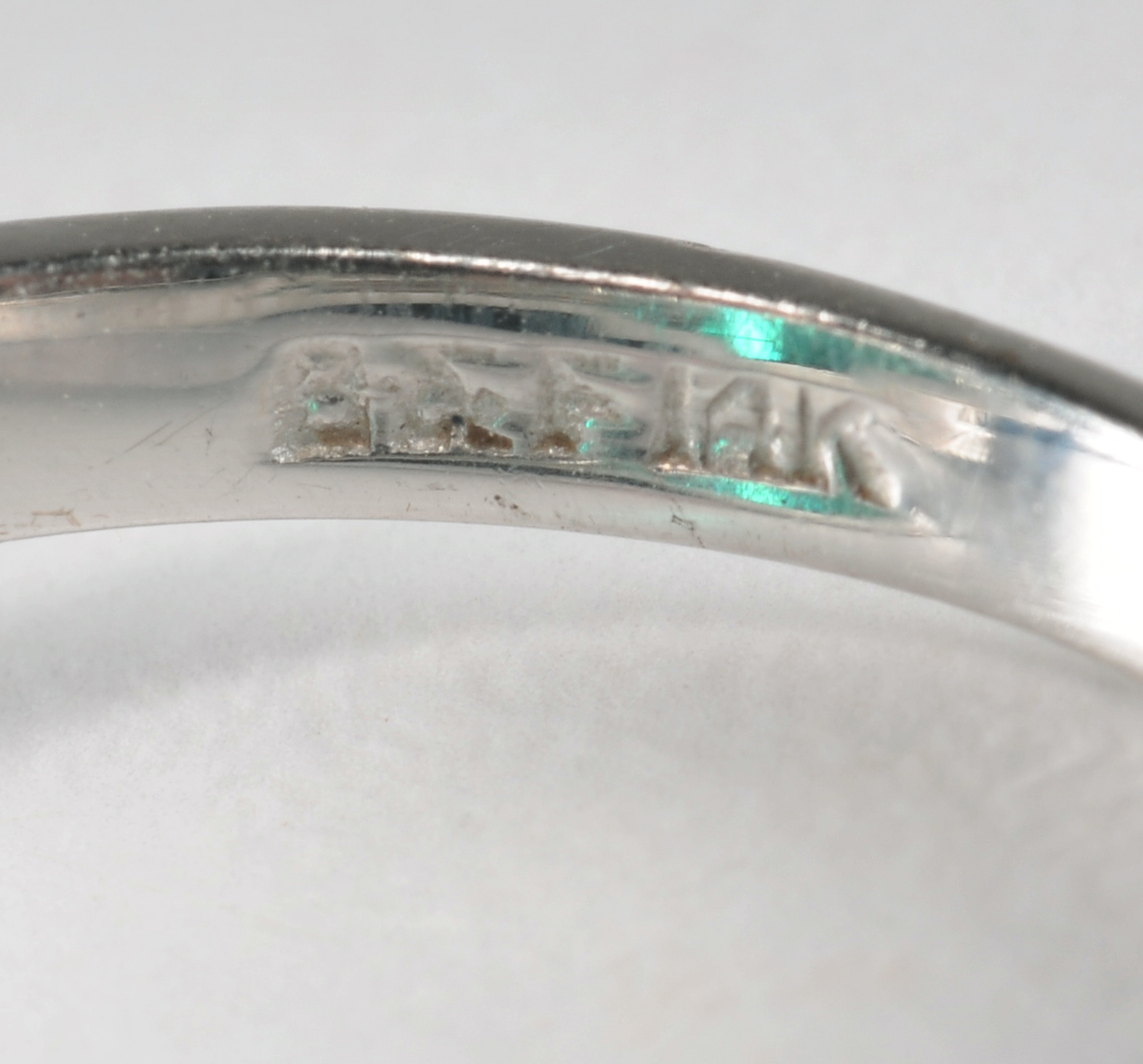 14 K white gold ladies ring with synthetic emerald and cubic zirconia stones