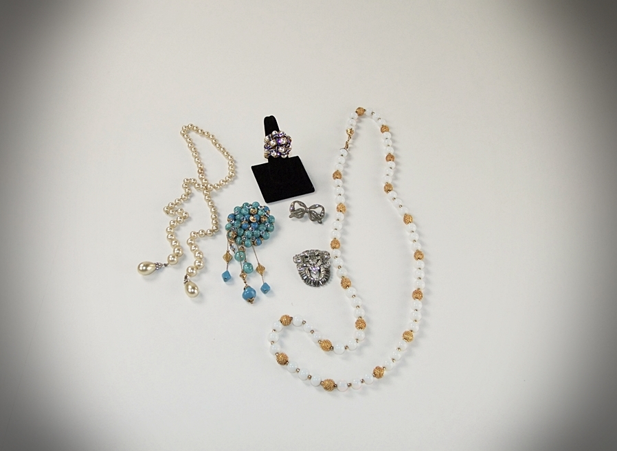 Collection of vintage costume jewelry including an Art Deco dress clip 