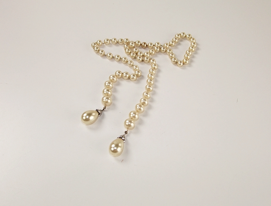 Collection of vintage costume jewelry including an Art Deco dress clip 