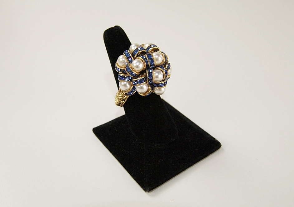 Collection of vintage costume jewelry including an Art Deco dress clip 