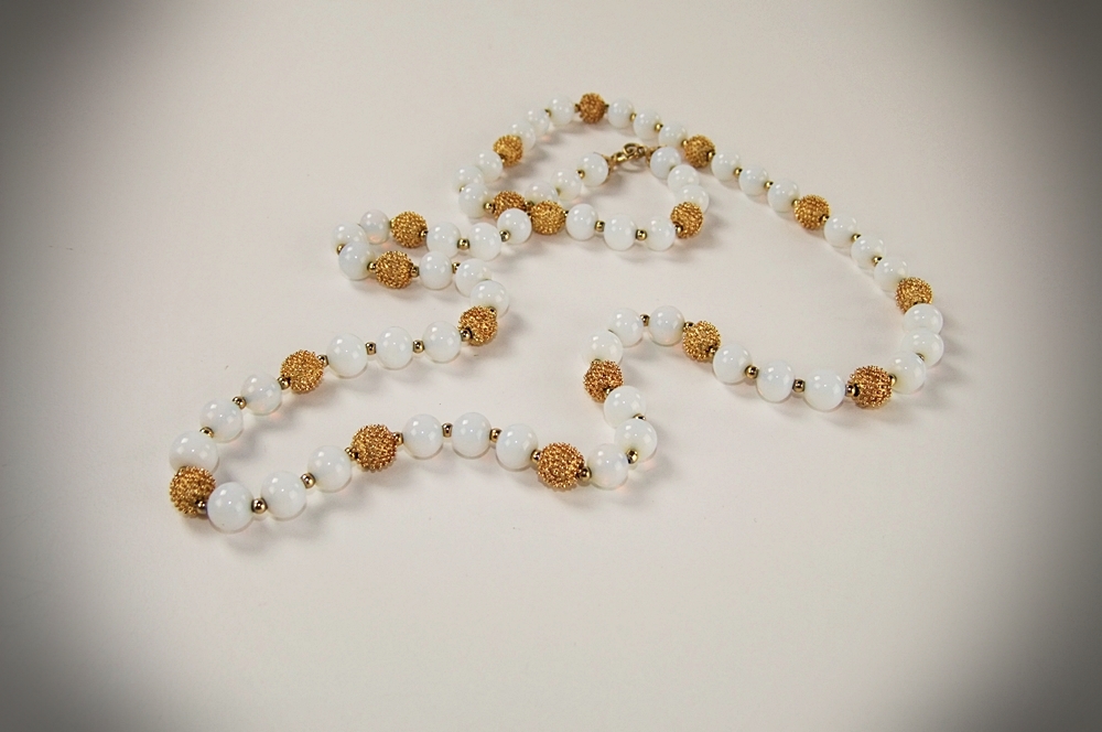 Collection of vintage costume jewelry including an Art Deco dress clip 