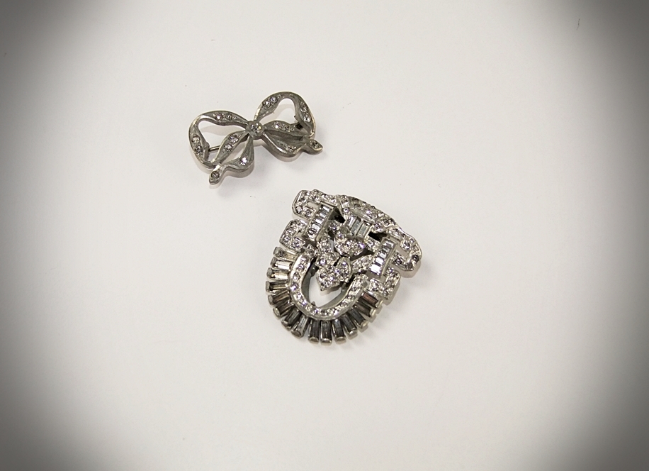 Collection of vintage costume jewelry including an Art Deco dress clip 