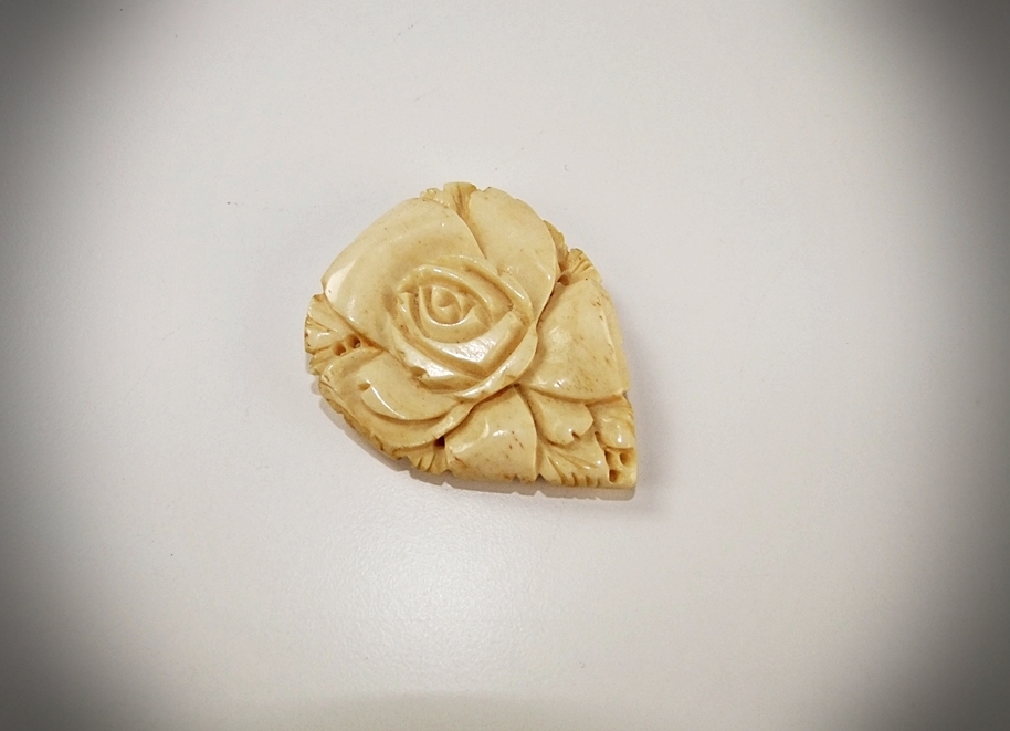 Early 20th Century hand carved ivory fur clip of a Rose