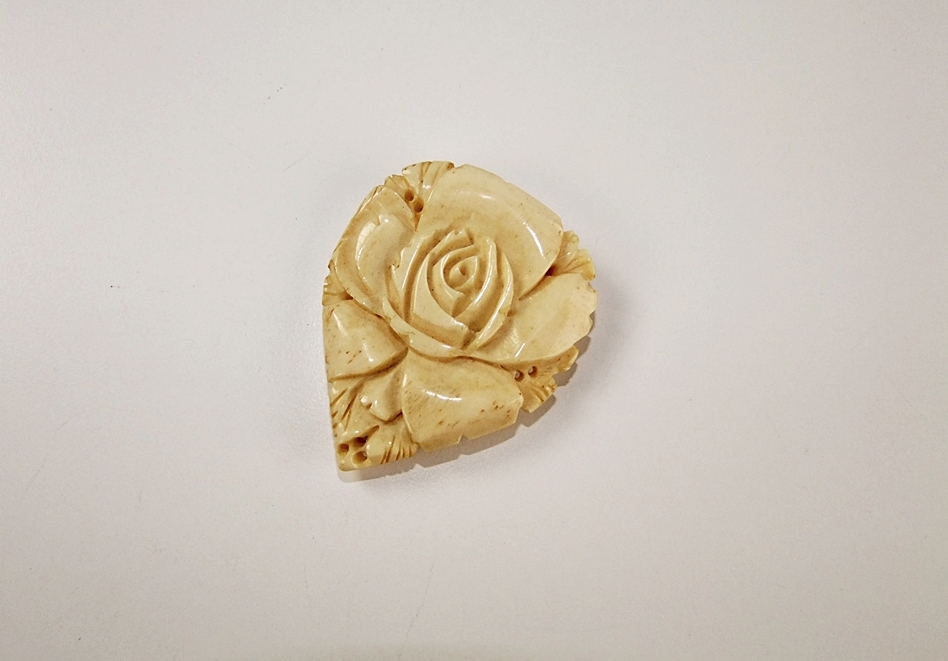 Early 20th Century hand carved ivory fur clip of a Rose