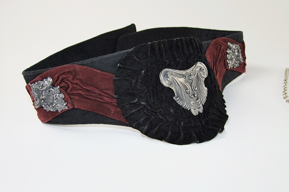 Black cotton belt with black and burgundy suede and applied silvertone Victorian style emblems and necklace
