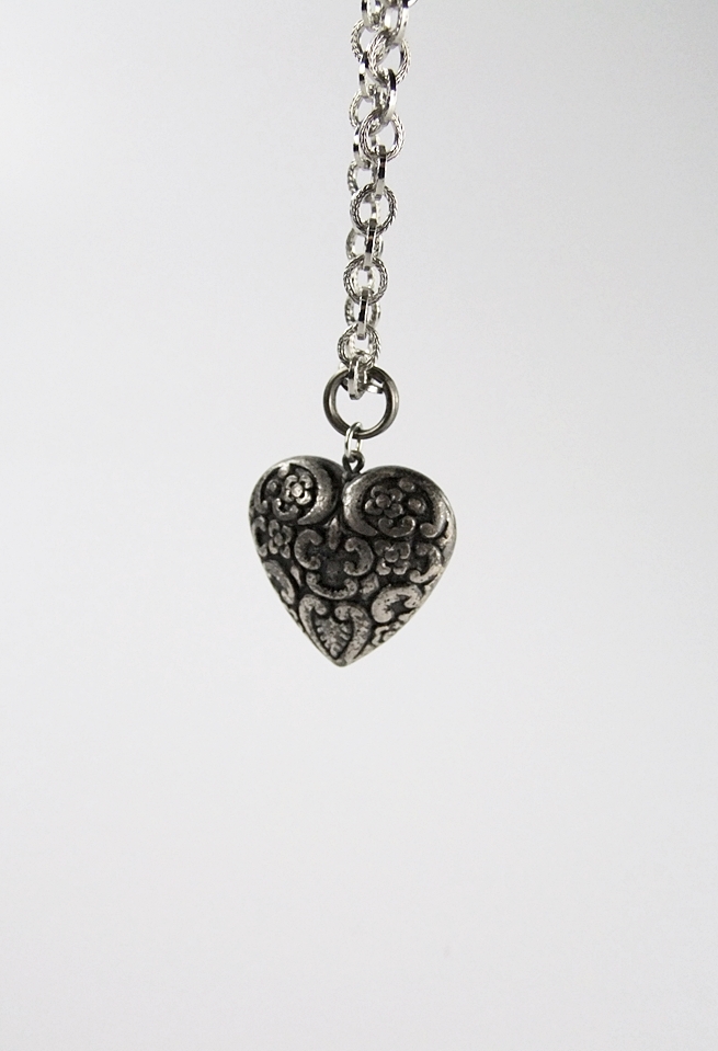 Black cotton belt with black and burgundy suede and applied silvertone Victorian style emblems and necklace