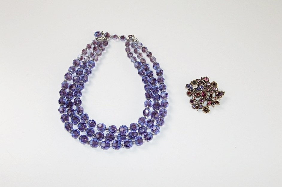 Marvella multi strand faceted cut glass necklace and a multi hued crystal rhinestone brooch 
