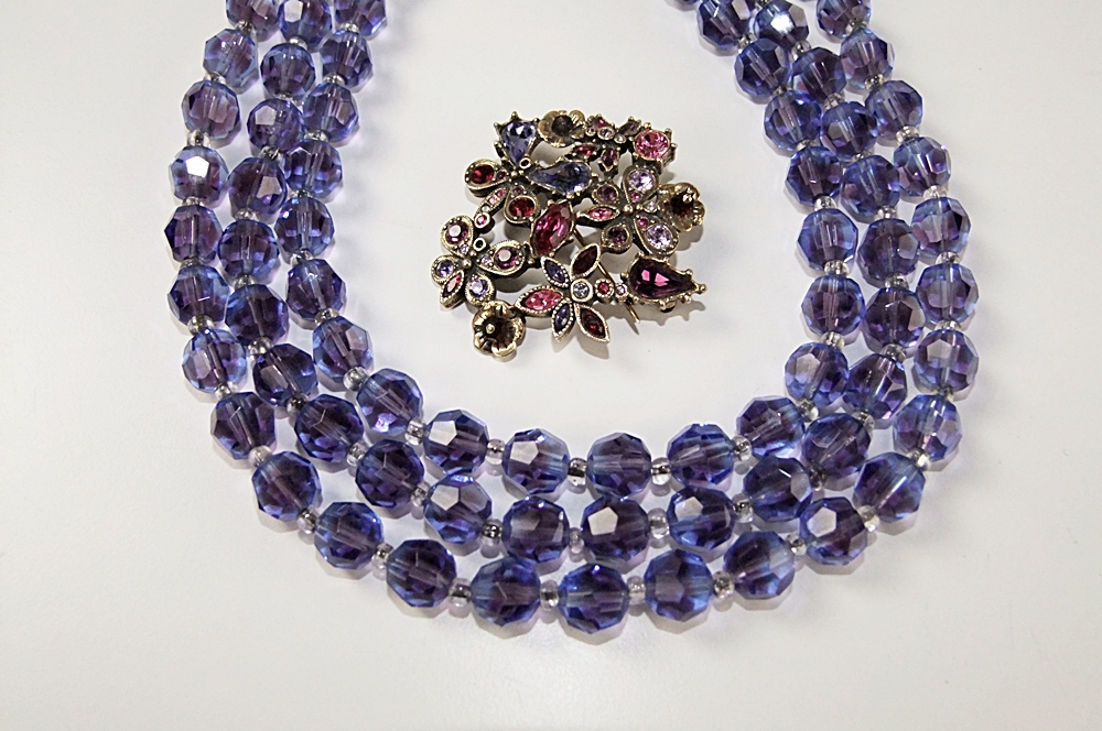 Marvella multi strand faceted cut glass necklace and a multi hued crystal rhinestone brooch 