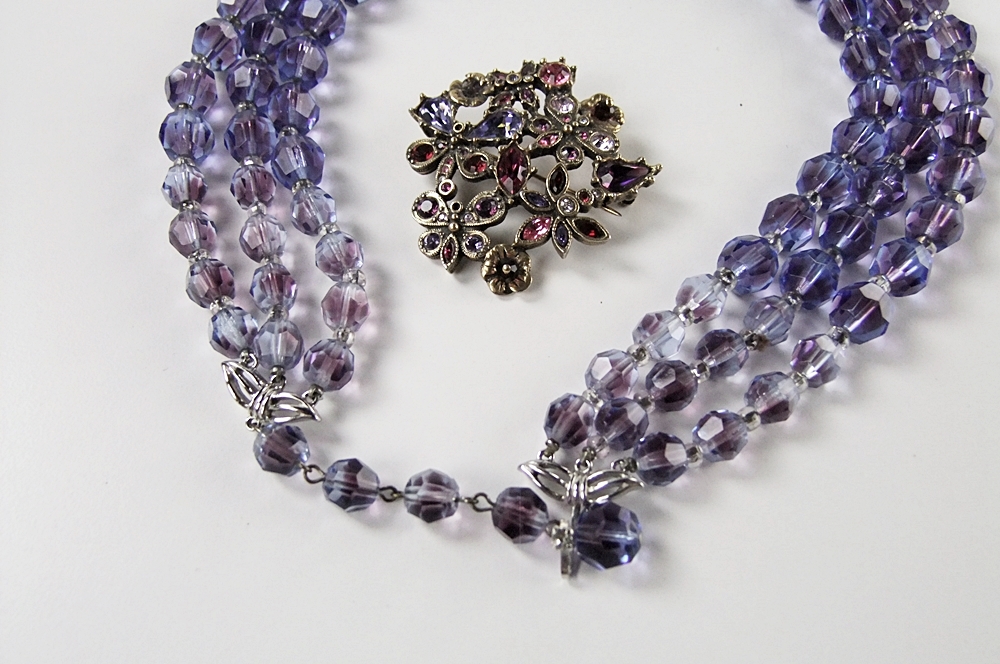 Marvella multi strand faceted cut glass necklace and a multi hued crystal rhinestone brooch 