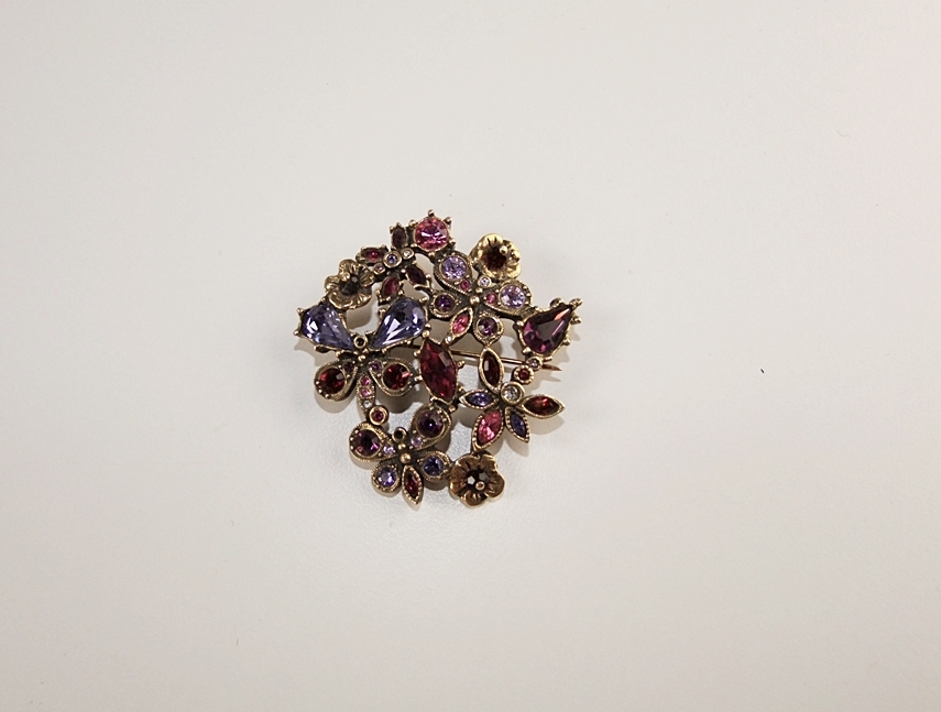 Marvella multi strand faceted cut glass necklace and a multi hued crystal rhinestone brooch 