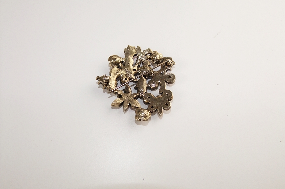 Marvella multi strand faceted cut glass necklace and a multi hued crystal rhinestone brooch 