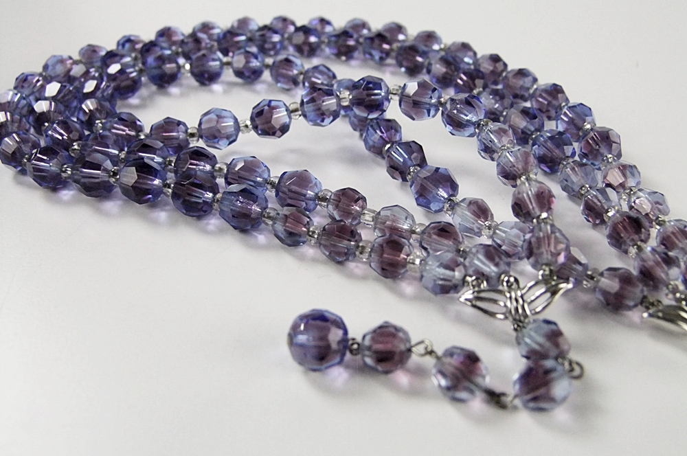 Marvella multi strand faceted cut glass necklace and a multi hued crystal rhinestone brooch 