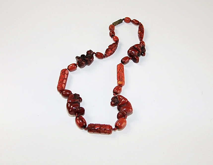 Vintage hand carved cherry amber beaded necklace