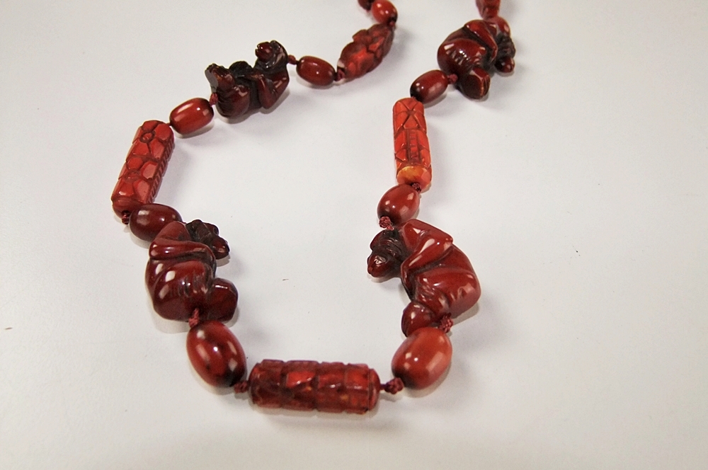 Vintage hand carved cherry amber beaded necklace